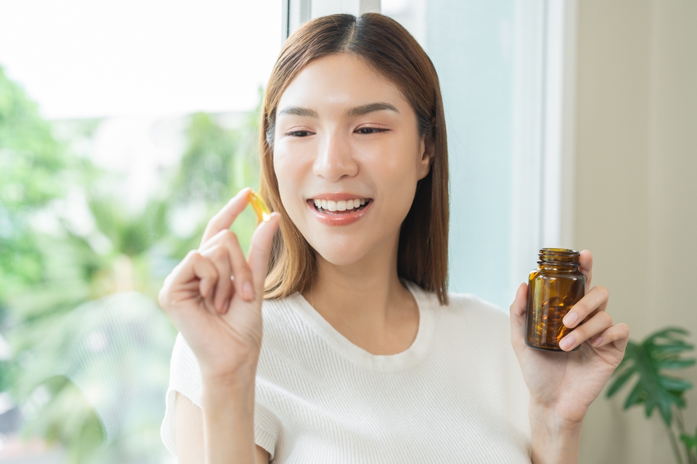 Woman about to take clean label supplements